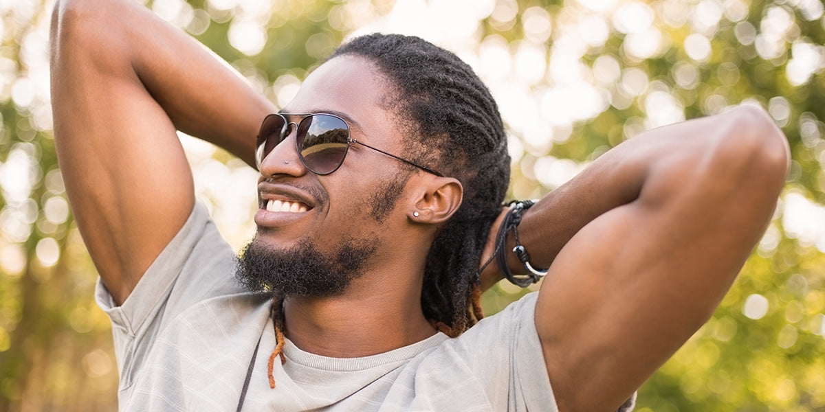 A bearded man basking in the sun.