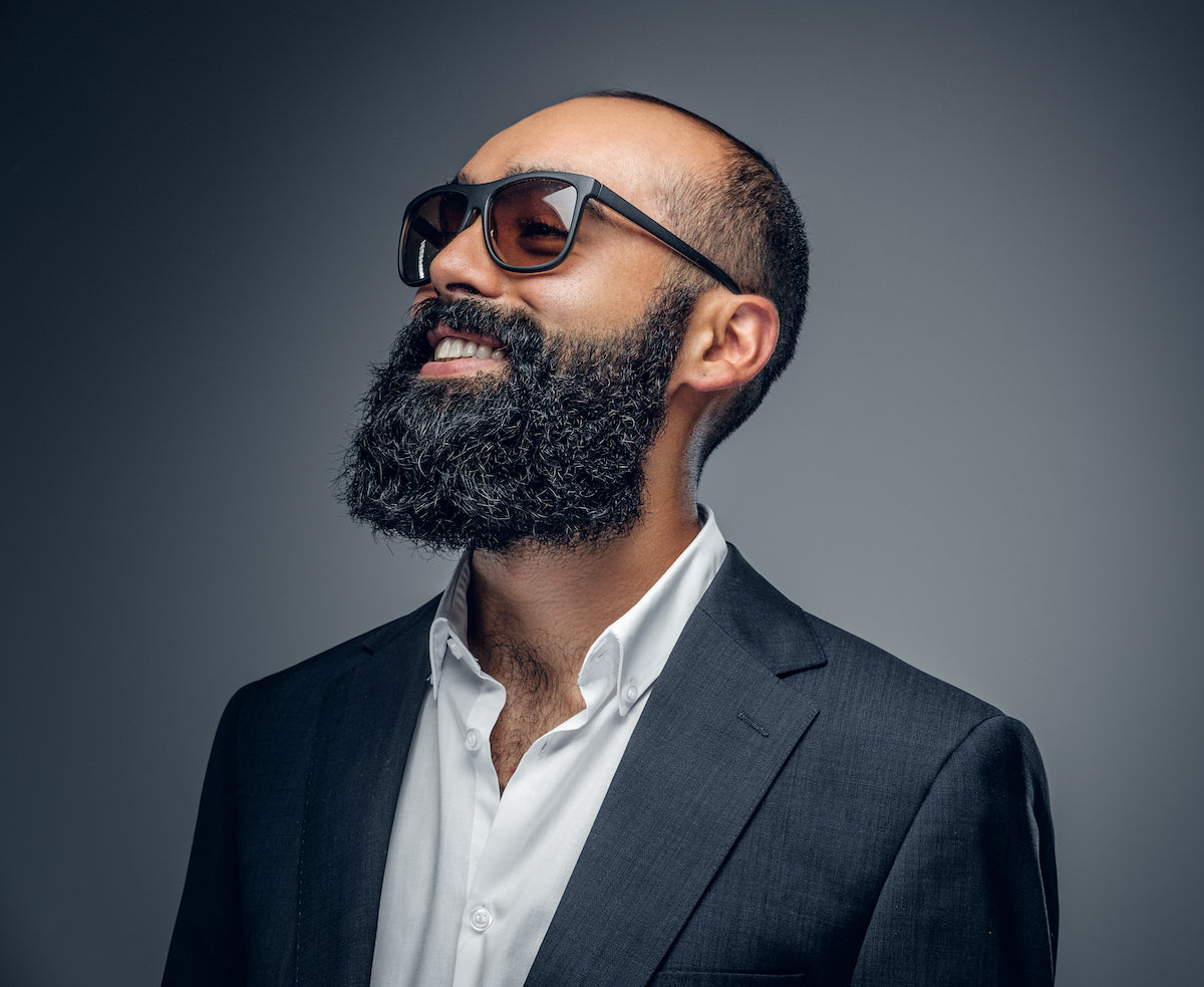 black man with full beard because of using beard oil